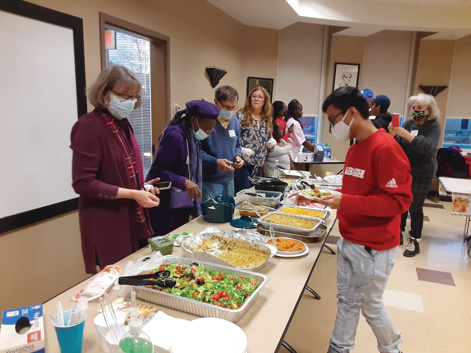 Volunteers from Bethel AME, Second Baptist and First Christian churches organized a Thanksgiving dinner for Wabash College international students and athletes Wednesday at the Malcolm X Institute of Black Studies.